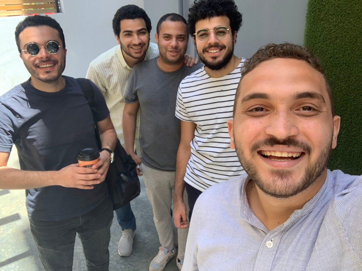 Engineering team members discussing sports data collection workflows